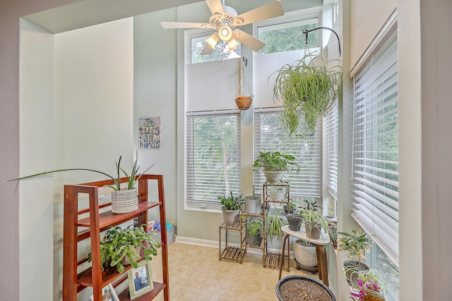 interior space featuring ceiling fan and a healthy amount of sunlight