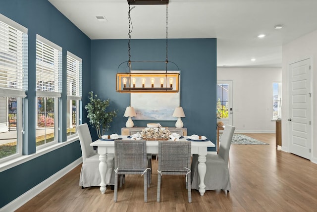 dining area featuring recessed lighting, wood finished floors, visible vents, and baseboards