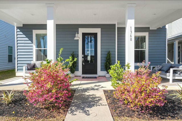 property entrance featuring a porch