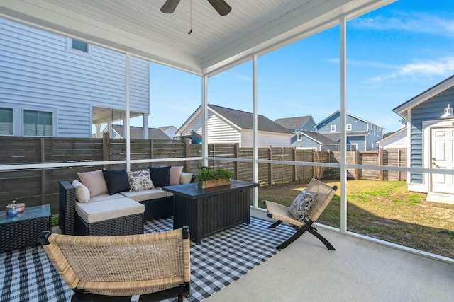 sunroom with a ceiling fan