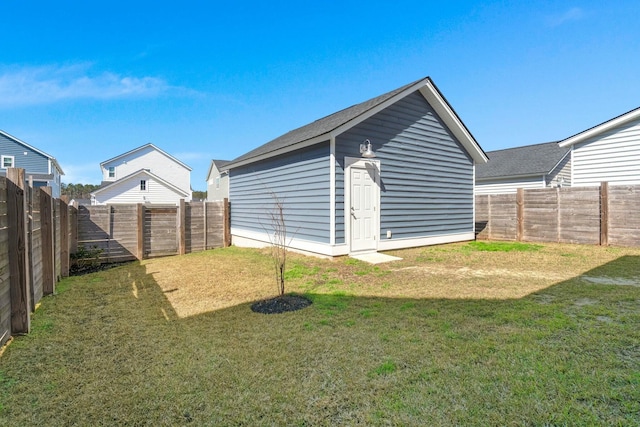 view of outdoor structure with a fenced backyard and an outdoor structure