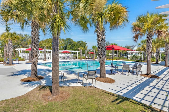 community pool with a patio area