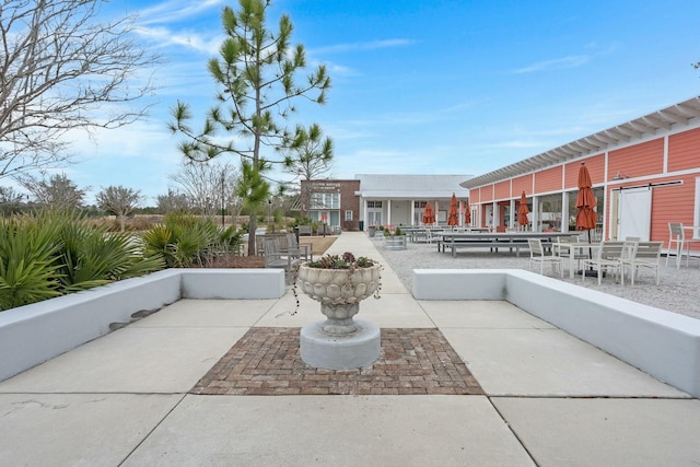 surrounding community with a patio area