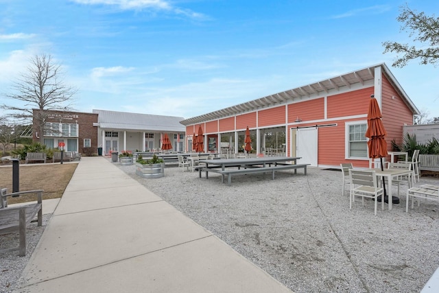 view of home's community featuring a patio area