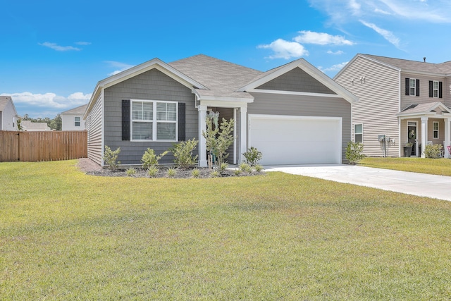 view of front of property with a front lawn and a garage