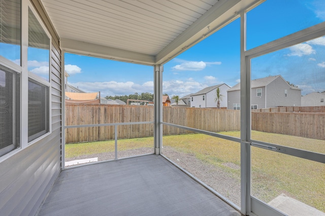 unfurnished sunroom featuring plenty of natural light