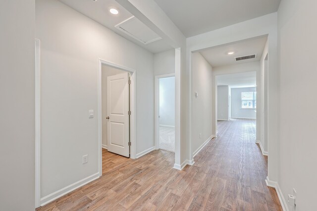 hall with light wood-type flooring