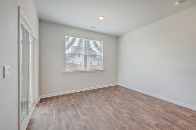 unfurnished room with light hardwood / wood-style flooring