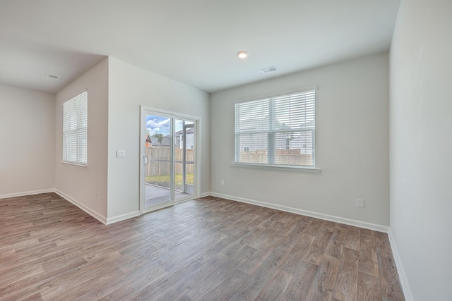 unfurnished room featuring light hardwood / wood-style flooring