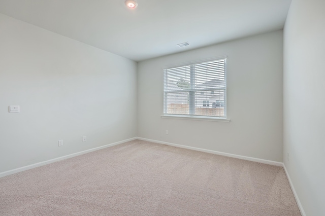 spare room featuring carpet floors