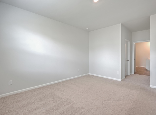 spare room with light colored carpet