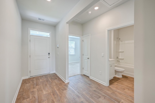 foyer entrance with light wood-type flooring