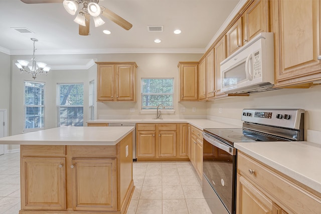 1308 Wild Olive Dr, Mount Pleasant, SC 29464 - kitchen with appliances with stainless steel finishes, light brown cabinetry, light tile patterned floors, light countertops, and a chandelier