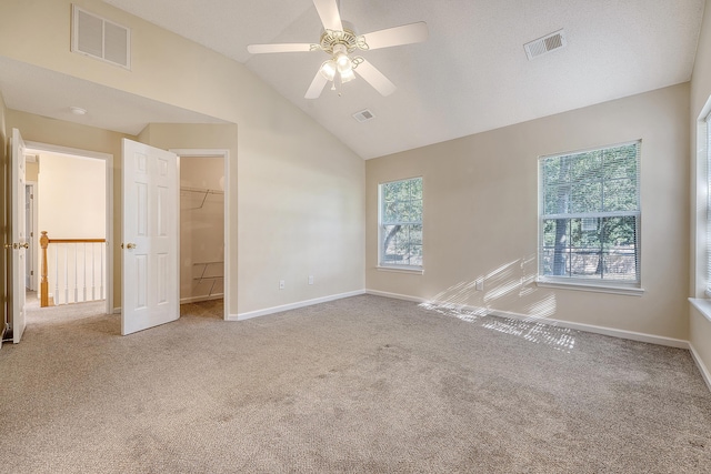 1308 Wild Olive Dr, Mount Pleasant, SC 29464 - unfurnished bedroom featuring carpet floors, vaulted ceiling, a walk in closet, ceiling fan, and a closet