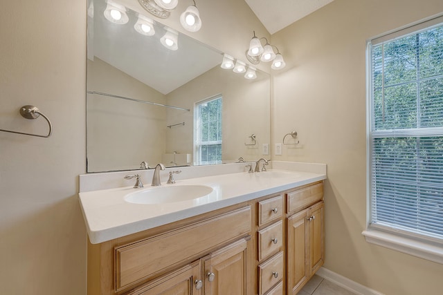 1308 Wild Olive Dr, Mount Pleasant, SC 29464 - bathroom featuring vaulted ceiling, double vanity, tile patterned floors, and a shower