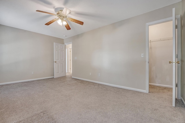 1308 Wild Olive Dr, Mount Pleasant, SC 29464 - unfurnished bedroom with a walk in closet, carpet floors, a ceiling fan, and a closet