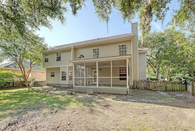1308 Wild Olive Dr, Mount Pleasant, SC 29464 - back of property with a sunroom, a fenced backyard, and a chimney