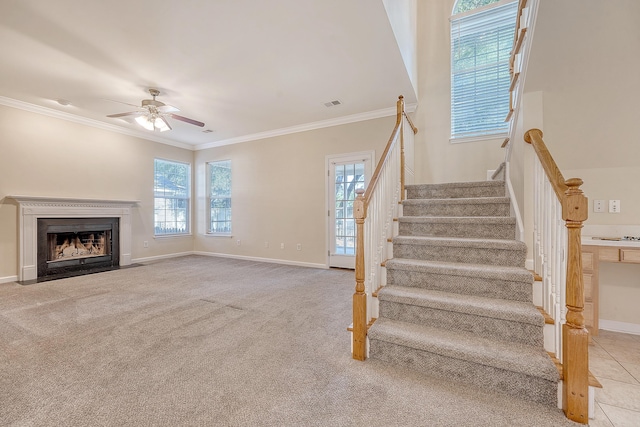 1308 Wild Olive Dr, Mount Pleasant, SC 29464 - stairway with a ceiling fan, ornamental molding, a fireplace with flush hearth, and carpet flooring