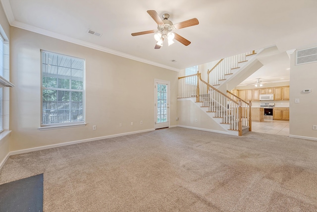 1308 Wild Olive Dr, Mount Pleasant, SC 29464 - unfurnished living room with a ceiling fan, ornamental molding, stairway, and light colored carpet