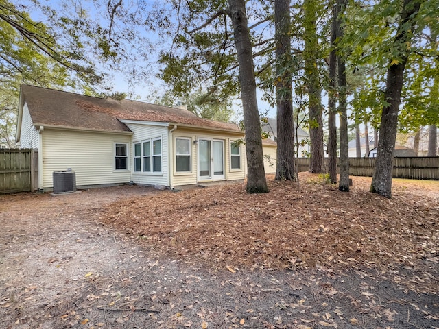 rear view of property featuring cooling unit