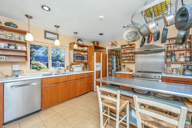 kitchen with light tile patterned floors, built in appliances, decorative light fixtures, and sink