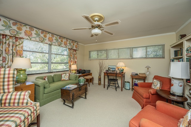 carpeted living room with ceiling fan and ornamental molding