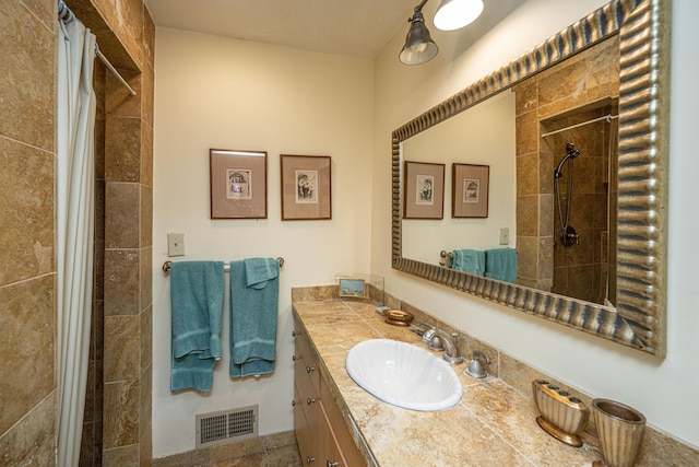 bathroom with vanity and curtained shower