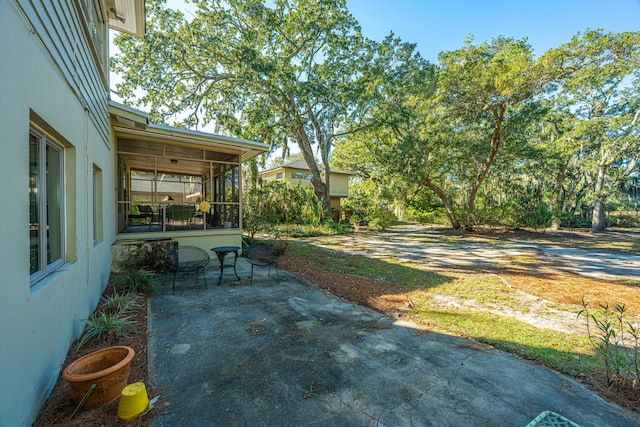 view of patio / terrace with a sunroom