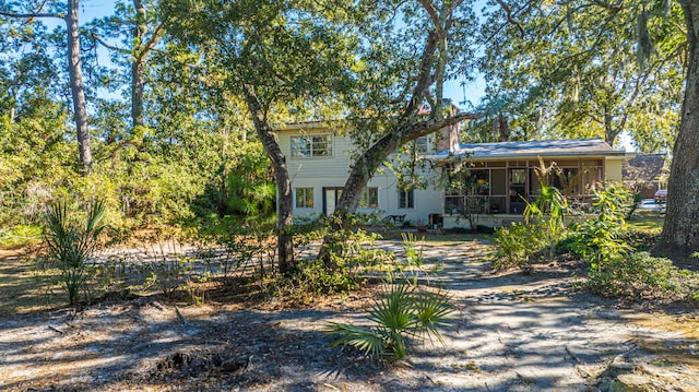 view of front of property with a sunroom