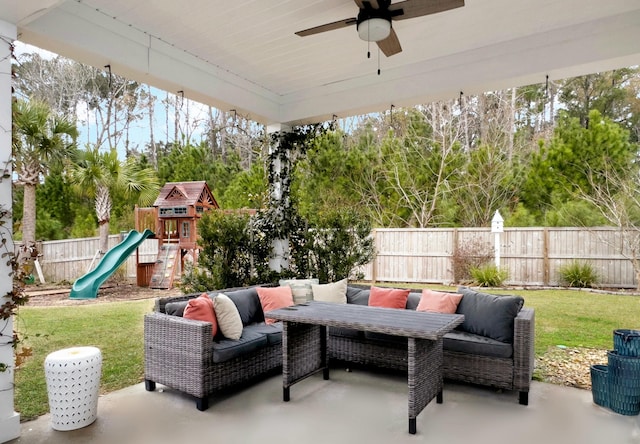 view of patio with ceiling fan, an outdoor hangout area, and a playground