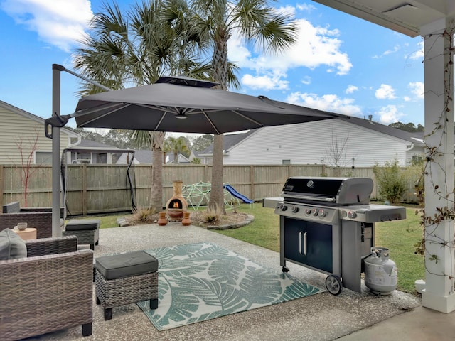 view of patio / terrace featuring a playground and area for grilling