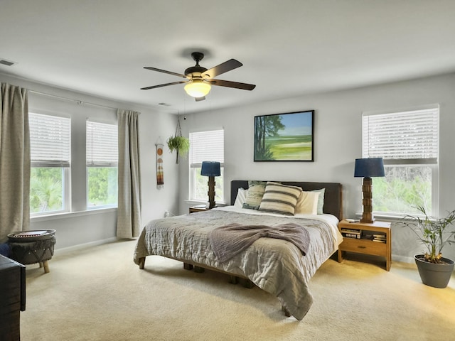 carpeted bedroom featuring ceiling fan