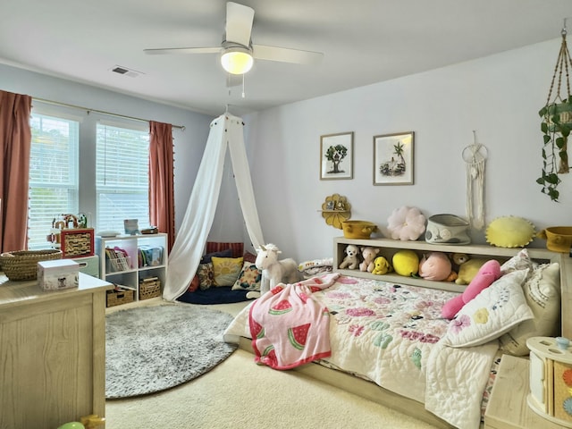 bedroom with ceiling fan and carpet