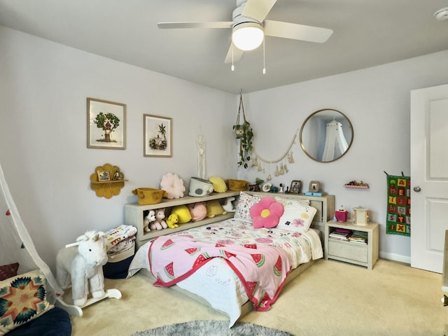 bedroom featuring light colored carpet and ceiling fan