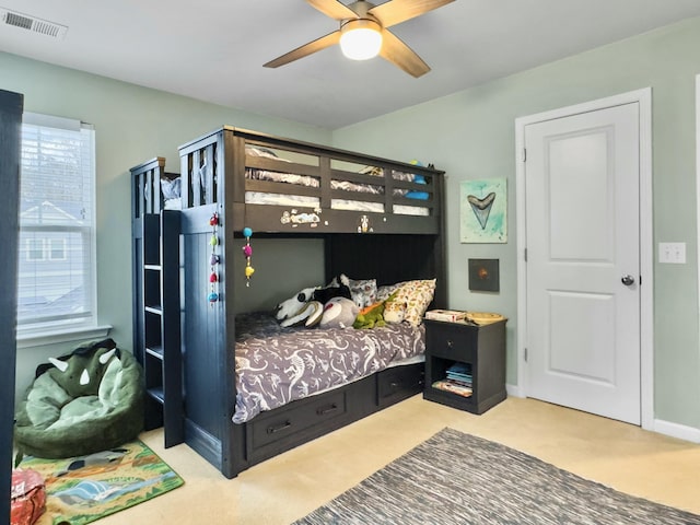 carpeted bedroom featuring ceiling fan