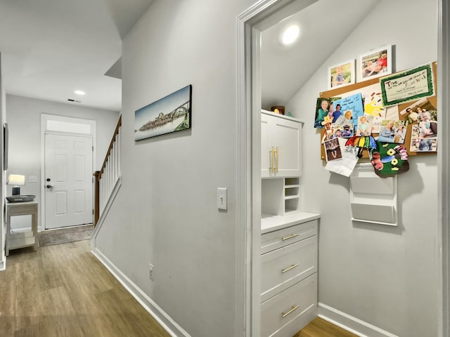 corridor featuring light hardwood / wood-style flooring