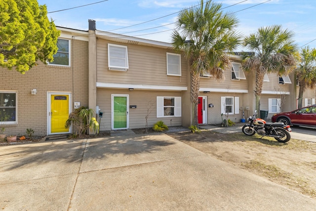 multi unit property featuring brick siding