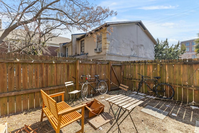 view of patio / terrace featuring fence