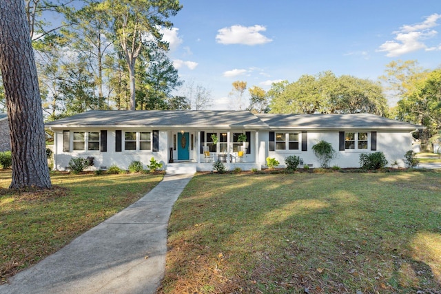 single story home with a porch and a front lawn