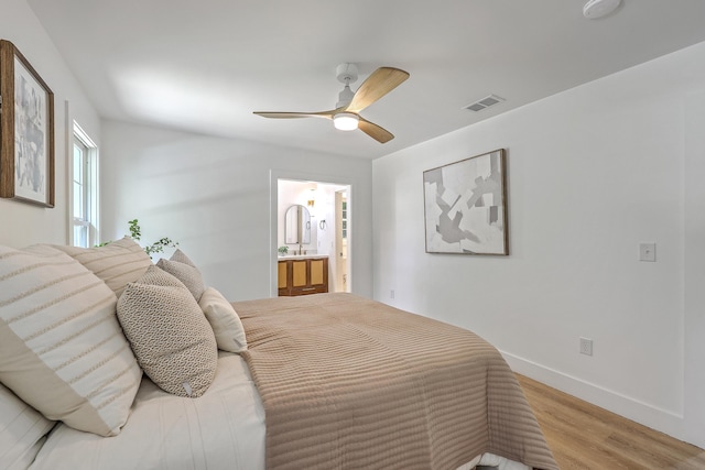 2534 Flamingo Dr, Charleston, SC 29414 - bedroom featuring light wood-style flooring, ensuite bath, baseboards, and ceiling fan