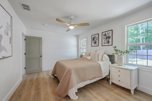 2534 Flamingo Dr, Charleston, SC 29414 - bedroom featuring multiple windows, light wood-style flooring, and baseboards
