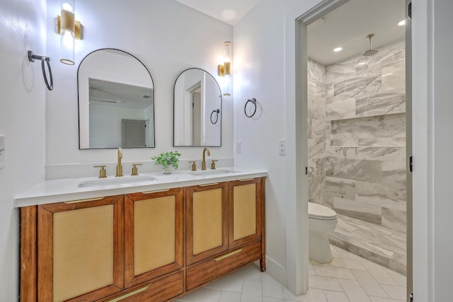2534 Flamingo Dr, Charleston, SC 29414 - bathroom featuring a tile shower, double vanity, toilet, and recessed lighting