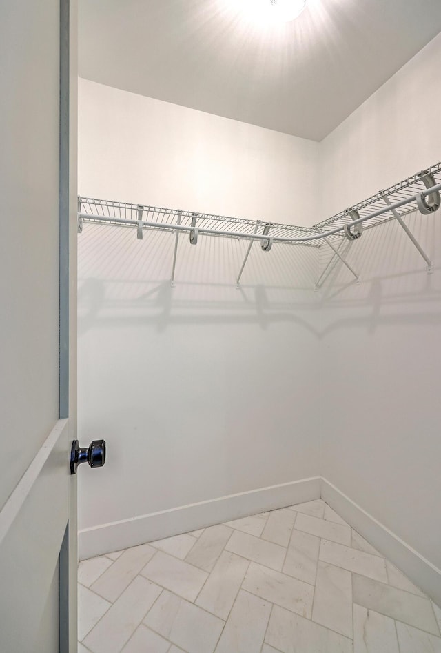 2534 Flamingo Dr, Charleston, SC 29414 - walk in closet featuring light marble finish floors