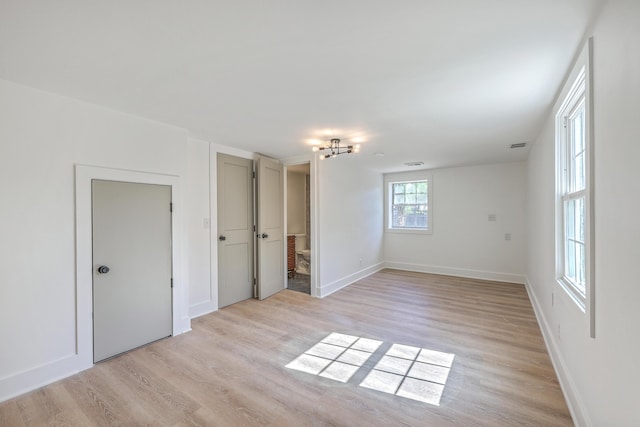 2534 Flamingo Dr, Charleston, SC 29414 - spare room with light wood-type flooring, baseboards, and a chandelier