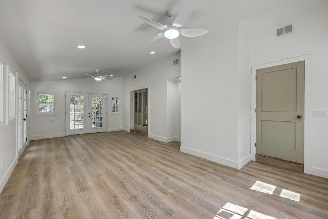 2534 Flamingo Dr, Charleston, SC 29414 - unfurnished living room with ceiling fan, light wood-style floors, french doors, lofted ceiling, and recessed lighting