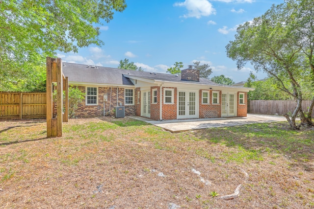 2534 Flamingo Dr, Charleston, SC 29414 - back of house with french doors, a patio area, brick siding, and central AC unit