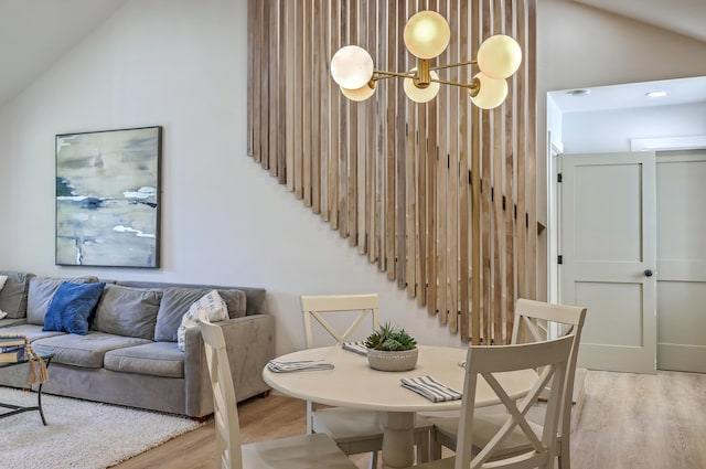 2534 Flamingo Dr, Charleston, SC 29414 - dining space featuring light wood finished floors, a chandelier, and high vaulted ceiling