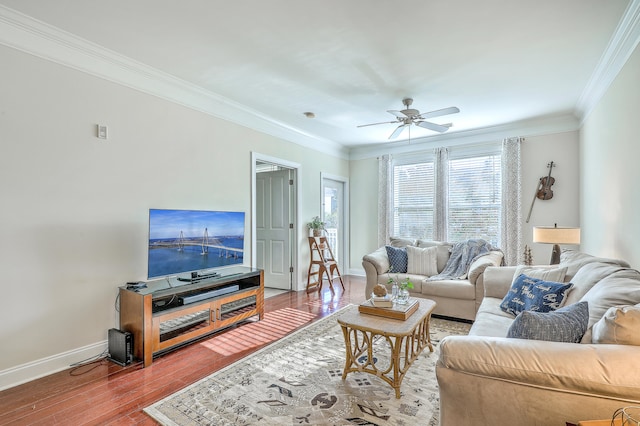 living room featuring crown molding, hardwood / wood-style floors, and ceiling fan