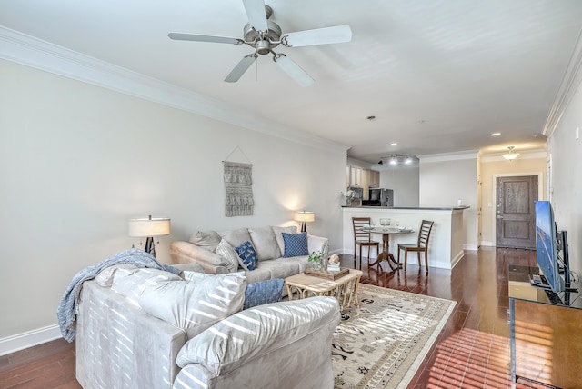 living room with ceiling fan, crown molding, and dark hardwood / wood-style floors