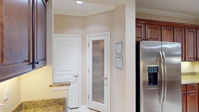 kitchen featuring stainless steel refrigerator with ice dispenser, light stone counters, and ornamental molding